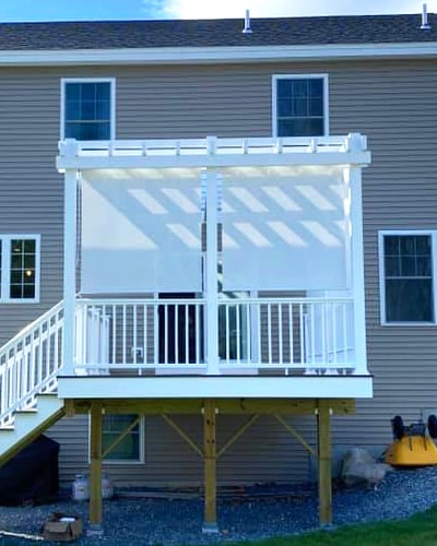 photo of a pergola with privacy curtains drawn