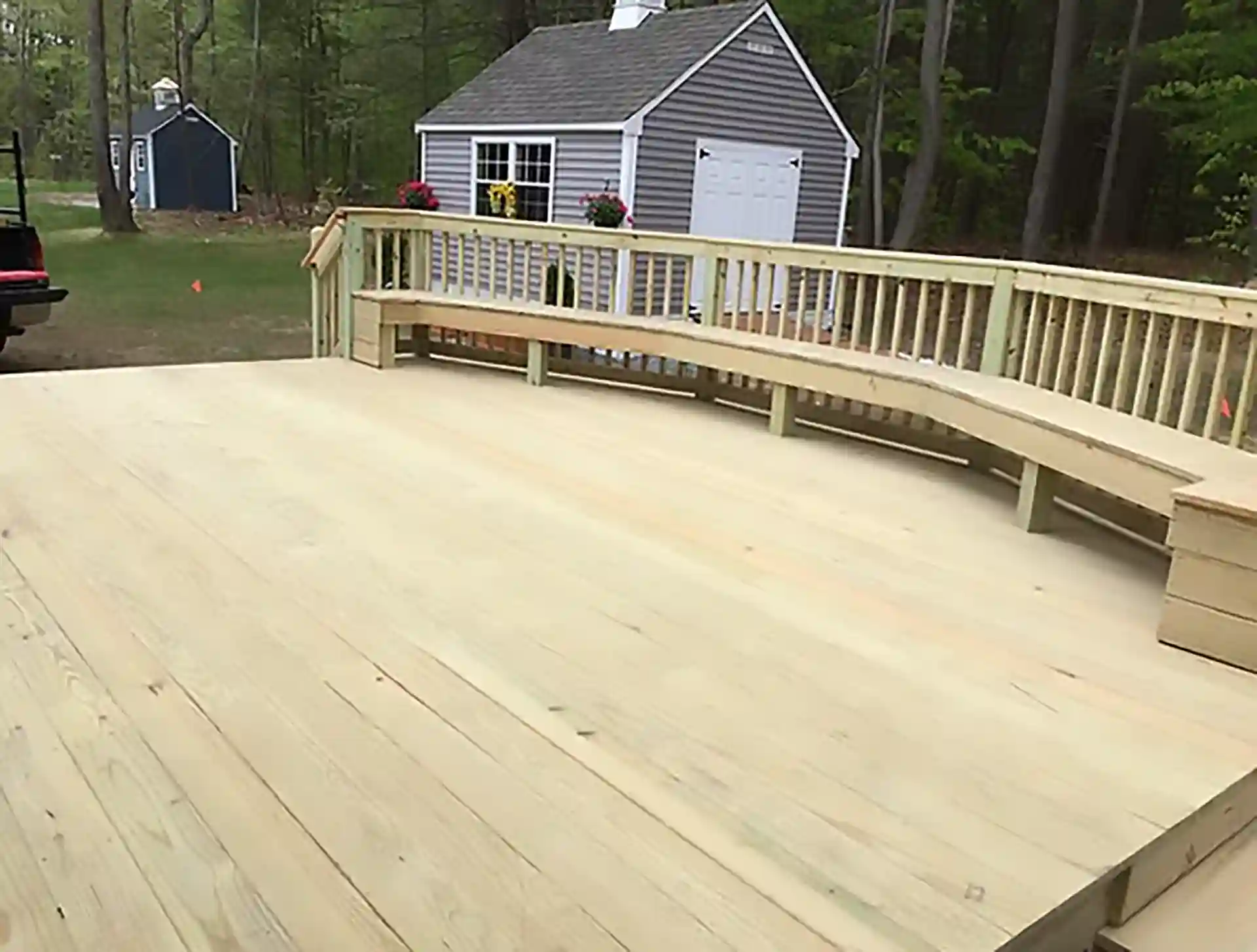 photo of wooden deck with built-in benches and wooden deck railing - Deck Railings Contractors and Wood Deck Builders in Dover NH