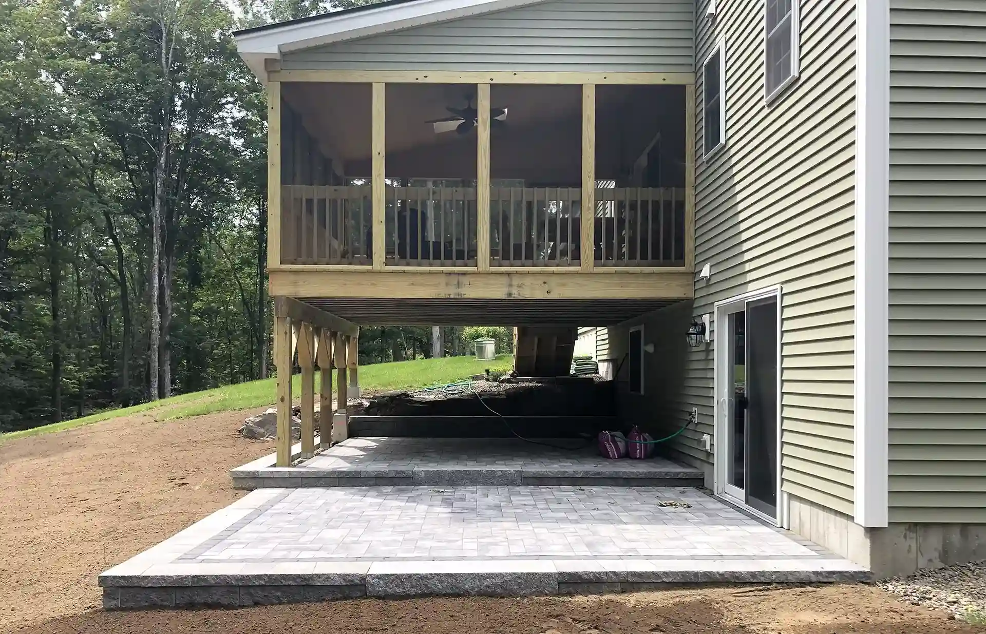 photo of an elevated outdoor room with patio below 